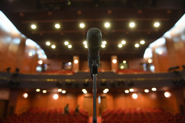 istock Microphone in front of an empty theatre hall 1216828860