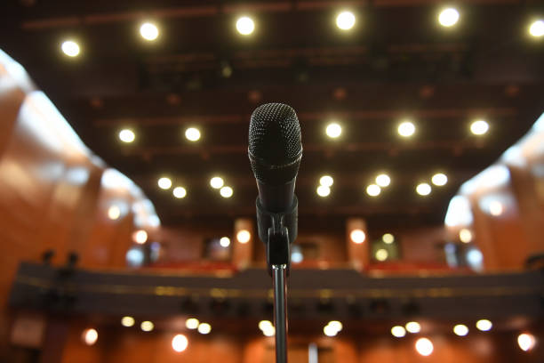 istock Microphone in front of an empty theatre hall 1216828909