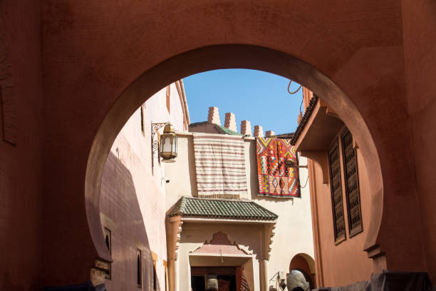 Marrakesh Medina Street View A view through an arch, wandering the Marrakesh Medina tapestry photos stock pictures, royalty-free photos & images