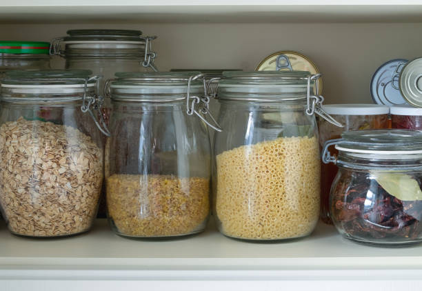 istock Separation in a kitchen cupboard or pantry with cereals and canned goods 1216830747