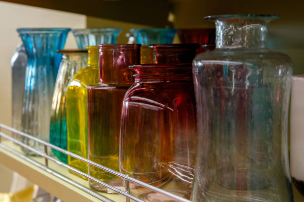 istock Glass flower vases on a shelf in a tableware store 1216831070