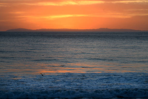 Colorful sky over the ocean at sunset or sunrise