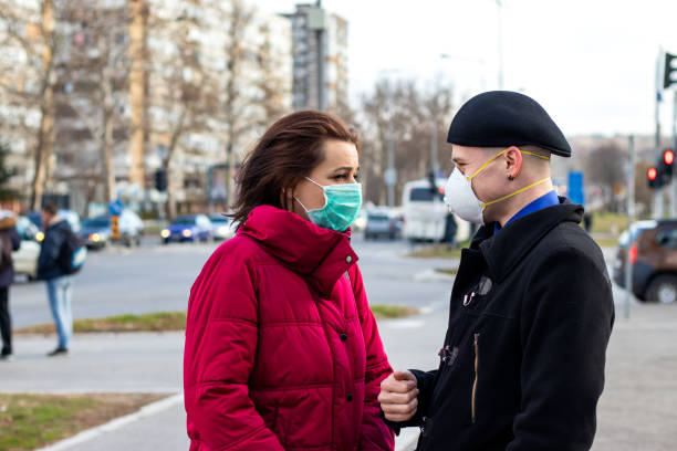 istock Young couple wearing masks for protection. 1216835017