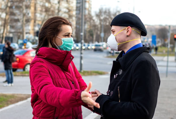 istock Young couple wearing masks for protection. 1216835078