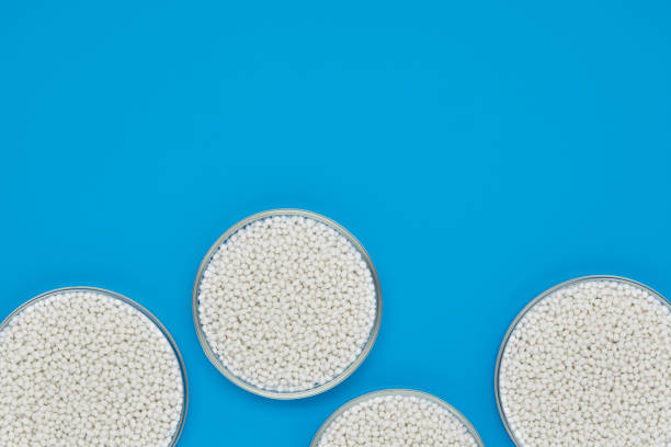 istock chemical bowl with white polymer granules 1216835372