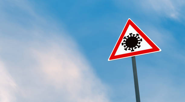 istock Corona Virus (Covid-19) traffic signs on the road 1216836334