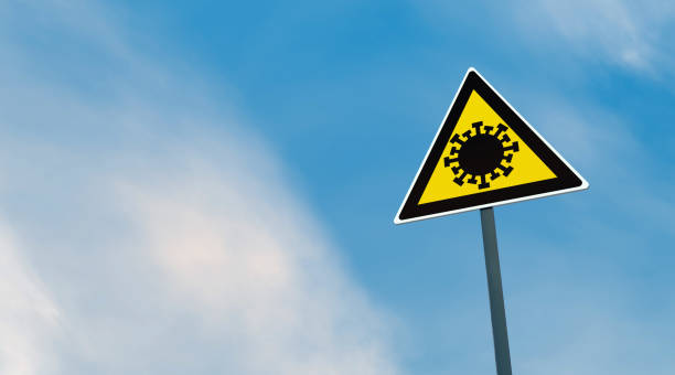 istock Corona Virus (Covid-19) traffic signs on the road 1216836355