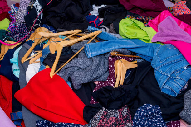 istock pile of used clothes. Second hand for recycling 1216838093