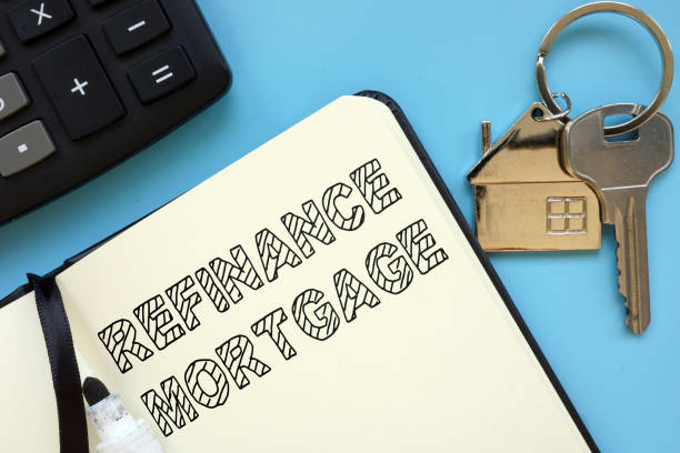 istock Text sign showing hand written words refinance mortgage 1216842297