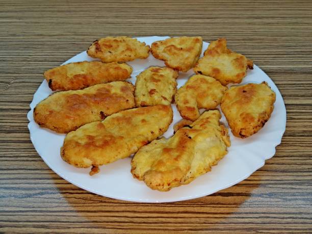 istock Several fried meat cutlets laid on a white porcelain plate 1216842949