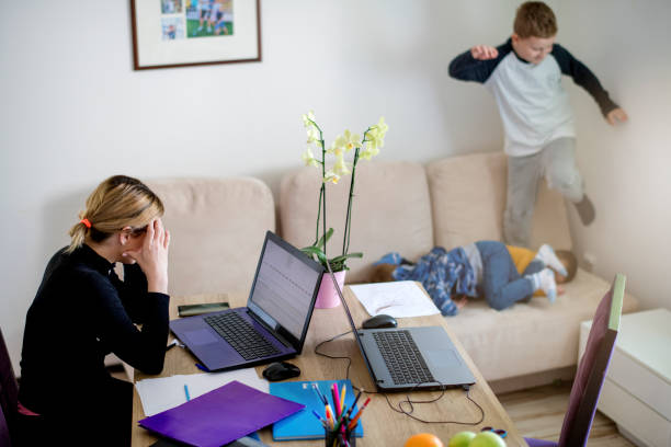 istock Mother working from home with young children in quarantine isolation 1216843077