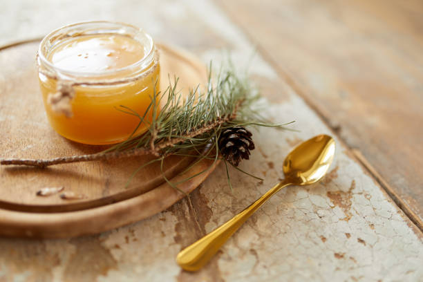 istock Honey jar on vintage wooden table. Top side view with copy space. Selective focus 1216844228