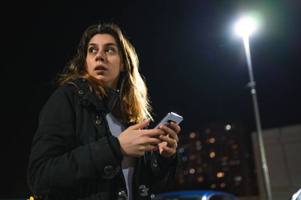 Worried abused woman text messaging