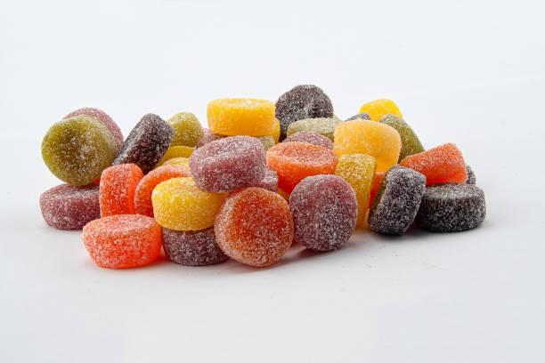 a pile of fruit pastille sweets - pastilles imagens e fotografias de stock