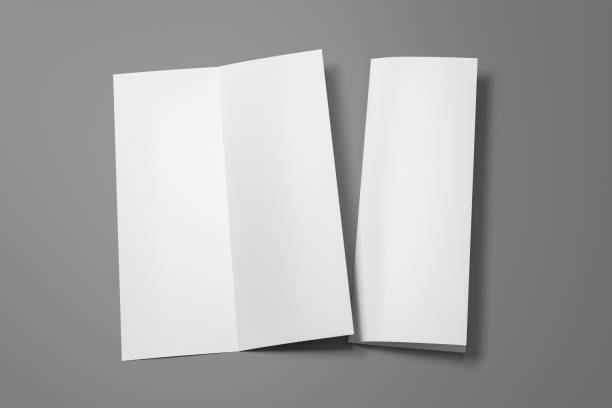 istock Blank bi-fold vertical A4 leaflet cover. Bi-fold or half-fold opened and folded brochure isolated with clipping path. 1216845669