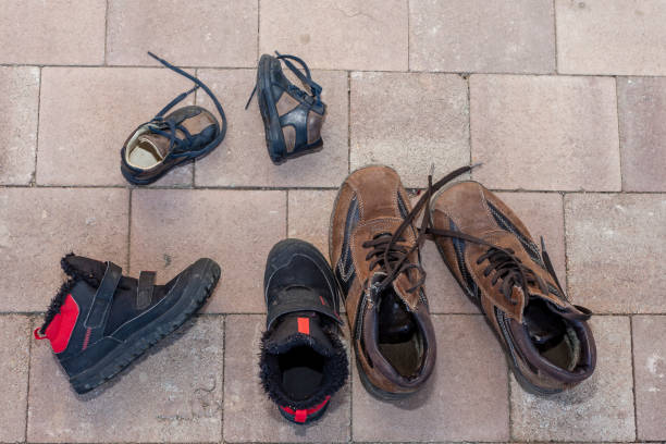 istock Three pairs of boots on the heap 1216845766