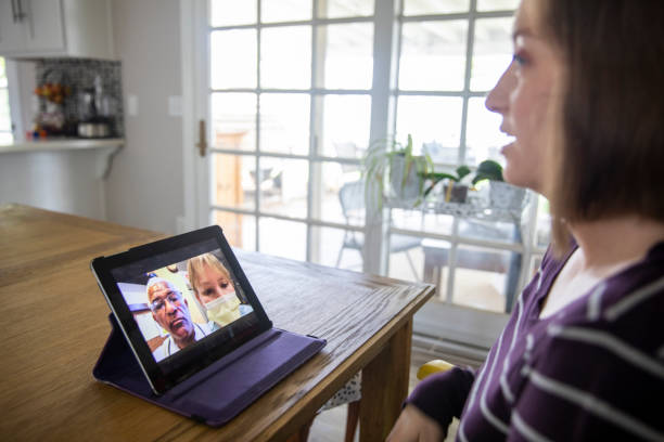 istock Young Woman Video Call with Doctors 1216846523
