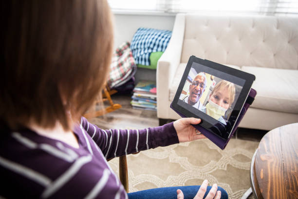istock Young Woman Video Call with Doctors 1216846725