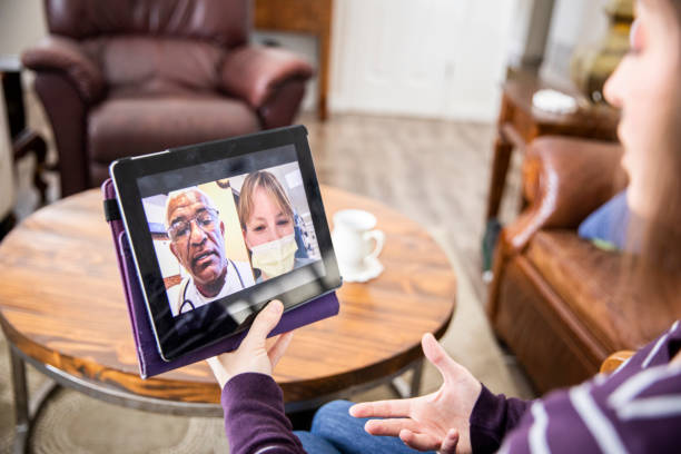 istock Young Woman Video Call with Doctors 1216846785