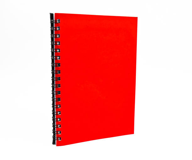 istock Portrait of a red color covered single note paper diary isolated on an empty white background 1216846995