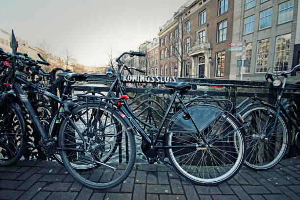 istock Bicycle on a Bridge in Amsterdam Netherlands Canal 1216851248