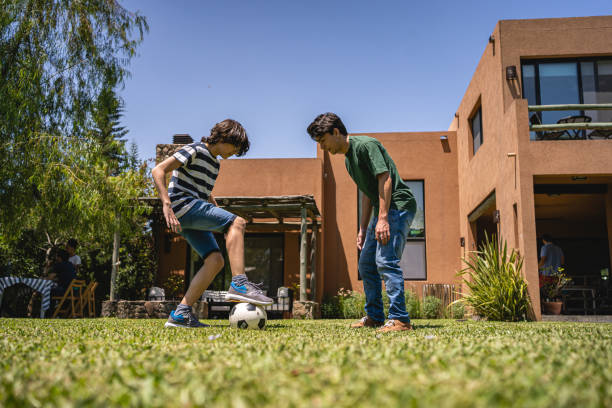 istock Playful brothers in their back yard 1216857711