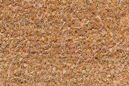Closeup of brown coir door mat suitable for use as a texture or background