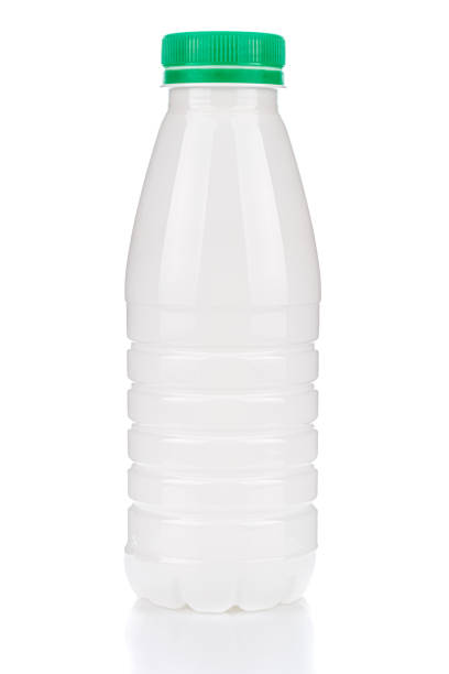 istock White plastic milk bottle with green cap isolated on white background with reflection on glossy surface 1216858378