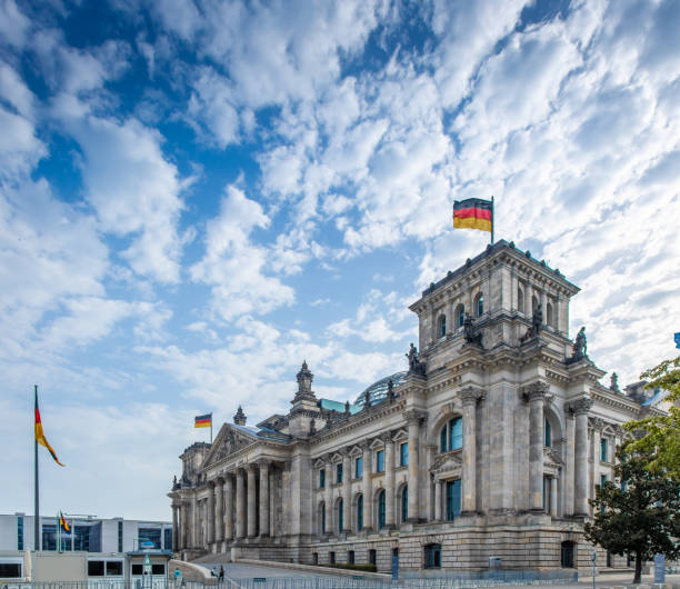 istock German flag waiving on Reichstag, Berlin 1216859415