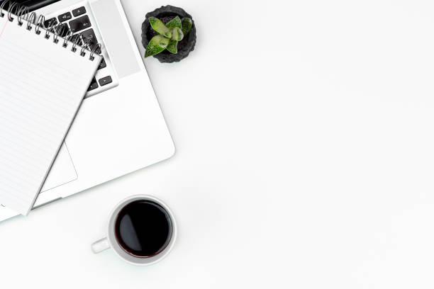 istock White office desk table layout flat lay, computer, glasses, coffee and note paper. copy space 1216860756