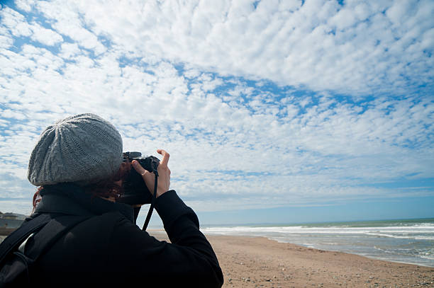 istock Sea side girl photographer 121686396