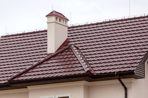 istock a brown rooftop of a ceramic tile with a pipe a storm drainage system and vent pipe, close up details of the architectural structure of a house. 1216864120