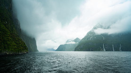 Clouds covering the mountains in Milford Sound, New Zealand