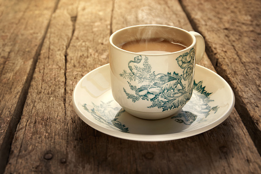Traditional oriental Chinese kopitiam style dark coffee in vintage mug.