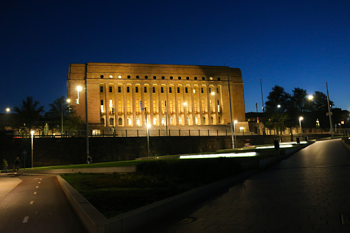 Finnish Parliament House (Eduskuntatalo) at night. The Finnish Parliament is a few minutes' walk from Helsinki central railway station. This building is a typical example of Nordic classicism in the 1920s.