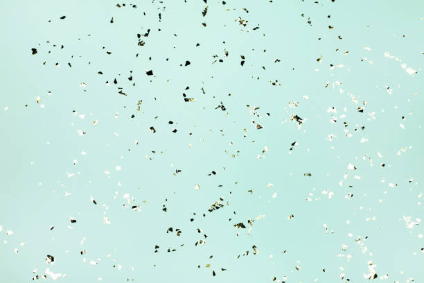 istock Golden flying sparkles on blue holiday background. 1216869443
