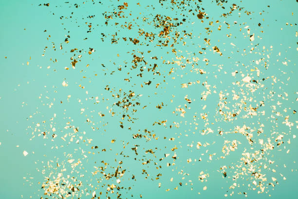 istock Golden flying sparkles on blue holiday background. 1216869446