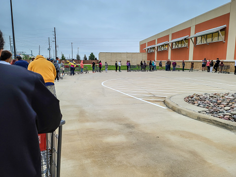 HOUSTON, TEXAS - March 21, 2020: Long Lines Waiting to get into an HEB Grocery Store Due to Coronavirus Pandemic.