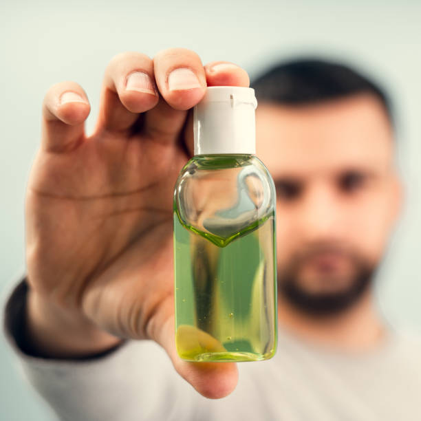 istock Applying an antiseptic to male hands. Personal protective equipment for the coronavirus pandemic. 1216870708