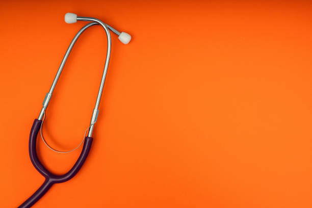 istock Phonendoscope on a colored background. Medical diagnostic tools. Mock up. Copy space, flat lay. 1216870937