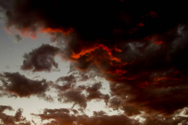 partly cloudy evening red sunset, red and black clouds dark image