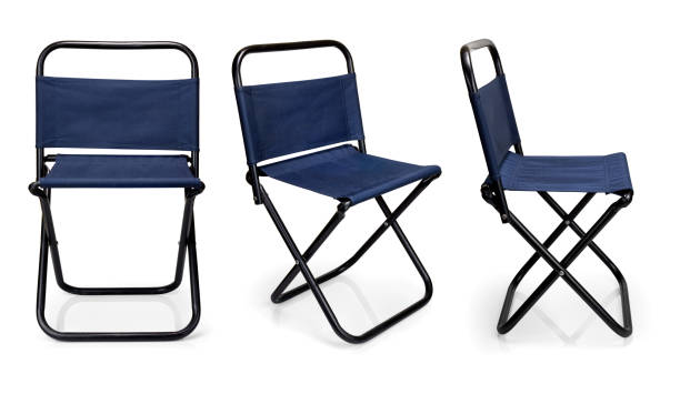 istock Black iron folding chair with blue fabric isolated on white background. 1216874517