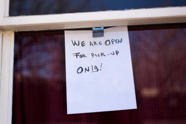 istock Handwritten Sign During Quarantine: Open for Pick-Up Only 1216888231