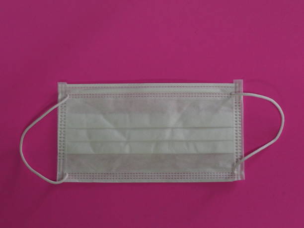 istock white mask self prevention ill on pink background for dust and germs pm 2.5, virus covid 19 1216890986