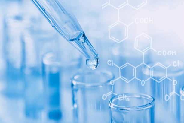 istock Laboratory glassware with a dropper dripping liquid into a test tube. scientific laboratory test tubes, laboratory equipment 1216901306