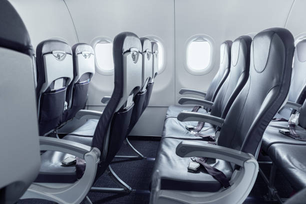 empty airplane cabin - airplane seat imagens e fotografias de stock