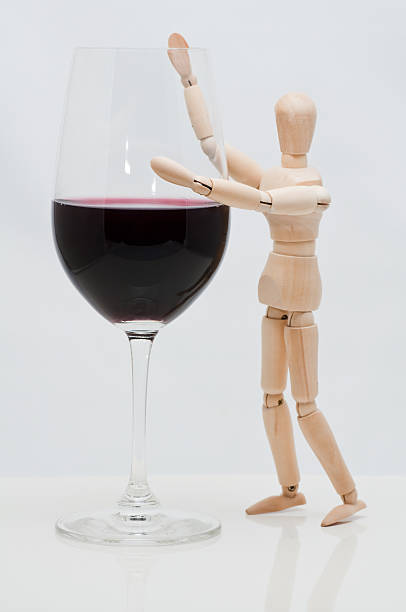 istock Mannequin holds a wineglass 121690238
