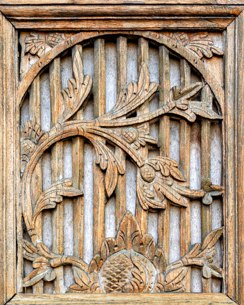 istock Flowers carved on wood 1216905811