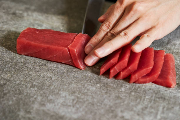 slicing tuna - tuna chunks imagens e fotografias de stock