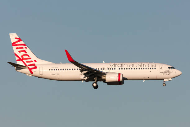 維珍澳大利亞航空公司波音737-8fe vh-yff在墨爾本國際機場降落。 - 維珍集團 個照片及圖片檔